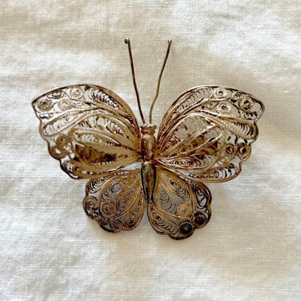 Vintage silver plate filigree butterfly brooch